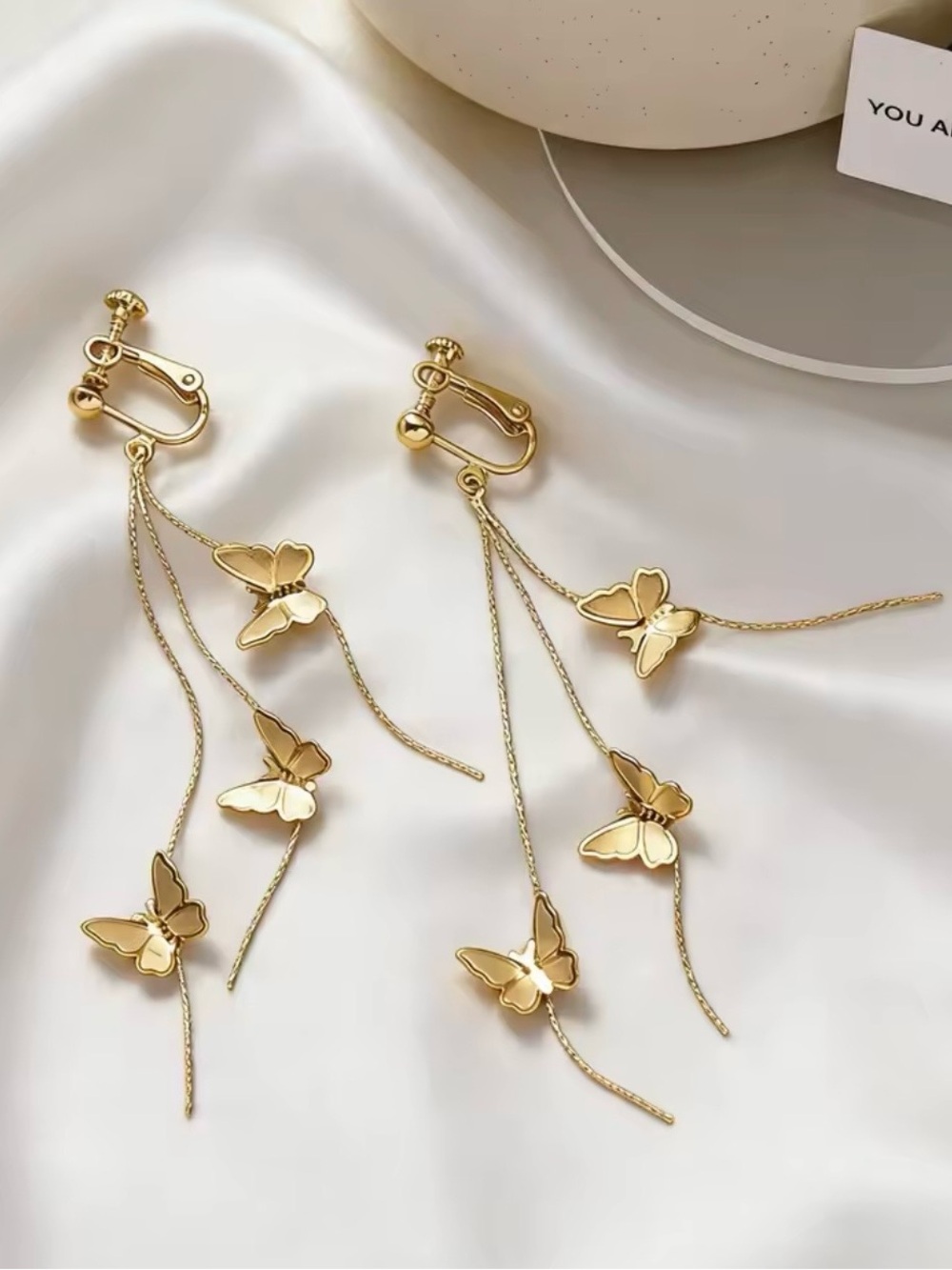 Gold Butterfly Dangle Clip-On Earrings flower wings angel cross drops